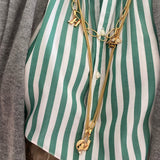 Monogram charm, A