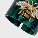 Stripey bee resin napkin rings, green tortoiseshell, set of four