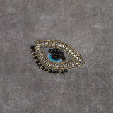 Embroidered evil eye pillow, grey cotton velvet